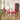 a wood dining table with 2 matching dining chairs in a modern setting