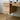 a natural wooden desk with drawers