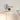 Plug in variant of the Wall Light Fixture, showing swing arm and round disk lamb shade