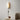 Plug in variant of Cylinder fabric wall sconce installed in a living room
