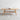 Rectangular wood coffee table with open shelf in natural wood color