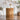 Round Fluted Side Table Image. Round side table with Vertical Texture Relief in Natural in a living space.