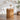 Round Fluted Side Table Image. Round side table with Vertical Texture Relief in Natural in a living space.