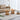 Side angled view of modern rattan and wood coffee table