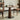 A Wood Pedestal Dining Table and Dining Chairs in a Modern Living Room