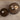 a close-up view of a solid wood round coffee table set of 2