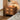 Wood Nightstand Image. A 2 drawer nightstand by the bedside in a warm lighted bedroom scenery