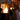 Row of bioethanol fire columns lighting outdoor restaurant terrace