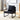 Black PU leather accent chair – angled front view with wood cabinet backdrop