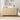 Boho rattan cabinet next to armchair with soft lighting