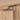 Brass handle detail with cabinet door slightly ajar