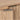 Brass handle detail with cabinet door slightly ajar