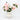 Large white ceramic vase filled with artificial pink peonies