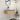 CharmyDecor 30-inch floating bathroom vanity mounted beneath a rounded mirror in a styled modern bathroom