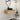 CharmyDecor 30-inch floating bathroom vanity in a modern bathroom beneath an oval mirror, styled with a black faucet