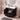 CharmyDecor 36 inch bathroom vanity with sink showing open cabinet doors and a lower drawer holding bathroom essentials.