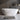 CharmyDecor matte white 55-inch freestanding soaking tub in a bathroom with dark walls and a wood shelf.