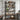 Wooden shelf with decorative items against a gray wall