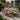charmydecor 69 inch outdoor acacia wood dining set with six wicker back chairs and beige cushions on a modern patio