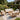 Charmydecor 7-seater acacia wood patio conversation set with beige cushions in garden setting