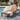 Charmydecor acacia wood outdoor chaise lounge with black metal frame beside a modern swimming pool