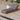 Charmydecor acacia wood outdoor chaise lounge with dark gray cushion on a poolside patio deck