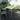 Green outdoor furniture set with table and chairs on a patio