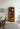charmydecor arched glass display cabinet with books and decor styling
