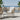charmydecor beige wicker outdoor dining chair with cushioned seat on modern seaside terrace