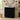 CharmyDecor black 30 inch bathroom vanity with sink in an angled bathroom view showing the fluted front and short legs.