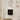 CharmyDecor black chestnut floating bathroom vanity with white ceramic sink beneath a mirror in a bright bathroom