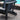charmydecor black folding Adirondack chair side detail with secure locking chain