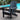 charmydecor black folding HDPE Adirondack chair beside an outdoor swimming pool