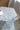 Hexagonal table with blue mosaic pattern on a blurred background