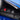Charmydecor blue kids car BMW M4 12V ride on toy car dashboard close-up showing power button, high/low speed switch, and forward/reverse control panel