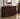 Wooden dresser with mirror and decorative items in a room setting