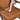 Charmydecor brown faux leather accent chair close-up showing solid wood armrest and cognac brown upholstery