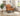 Charmydecor brown faux leather accent chair styled in a bright modern living room reading corner