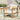 charmydecor brown wash acacia wood outdoor club chair with beige cushions styled on a patio rug