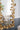 charmydecor close up of gold leaf mirror frame with textured metallic floral details