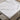 charmydecor close-up of white marble-look coffee table top with soft gray veining