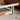 Close-up of a chair with metal frame and wooden seat on a blurred background