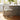 CharmyDecor counter height stool metal base in beige fabric shown in modern kitchen island setting with elegant lighting