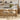Modern kitchen with two wooden counter stools and a white countertop.