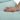 Hand resting on a light blue fabric surface