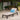 Dark brown patio chaise lounge with beige cushion in an outdoor garden setting from charmydecor