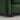 Close-up of a green upholstered chair corner on a textured surface