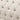 Close-up of a tufted beige fabric surface