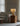 charmydecor fiberglass table lamp with warm ambient glow on reflective surface