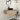 CharmyDecor floating bathroom vanity wall-mounted beneath a rounded mirror in a modern bathroom scene